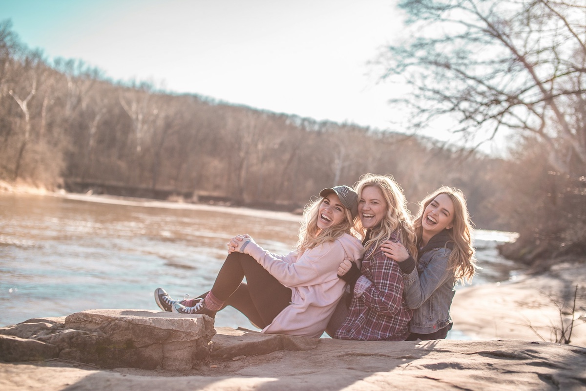 Three women enjoying spending time together in nature