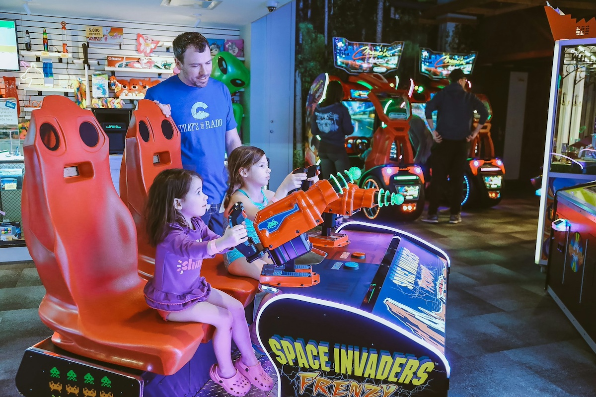 Young students going to the arcade as a reward for their schoolwork